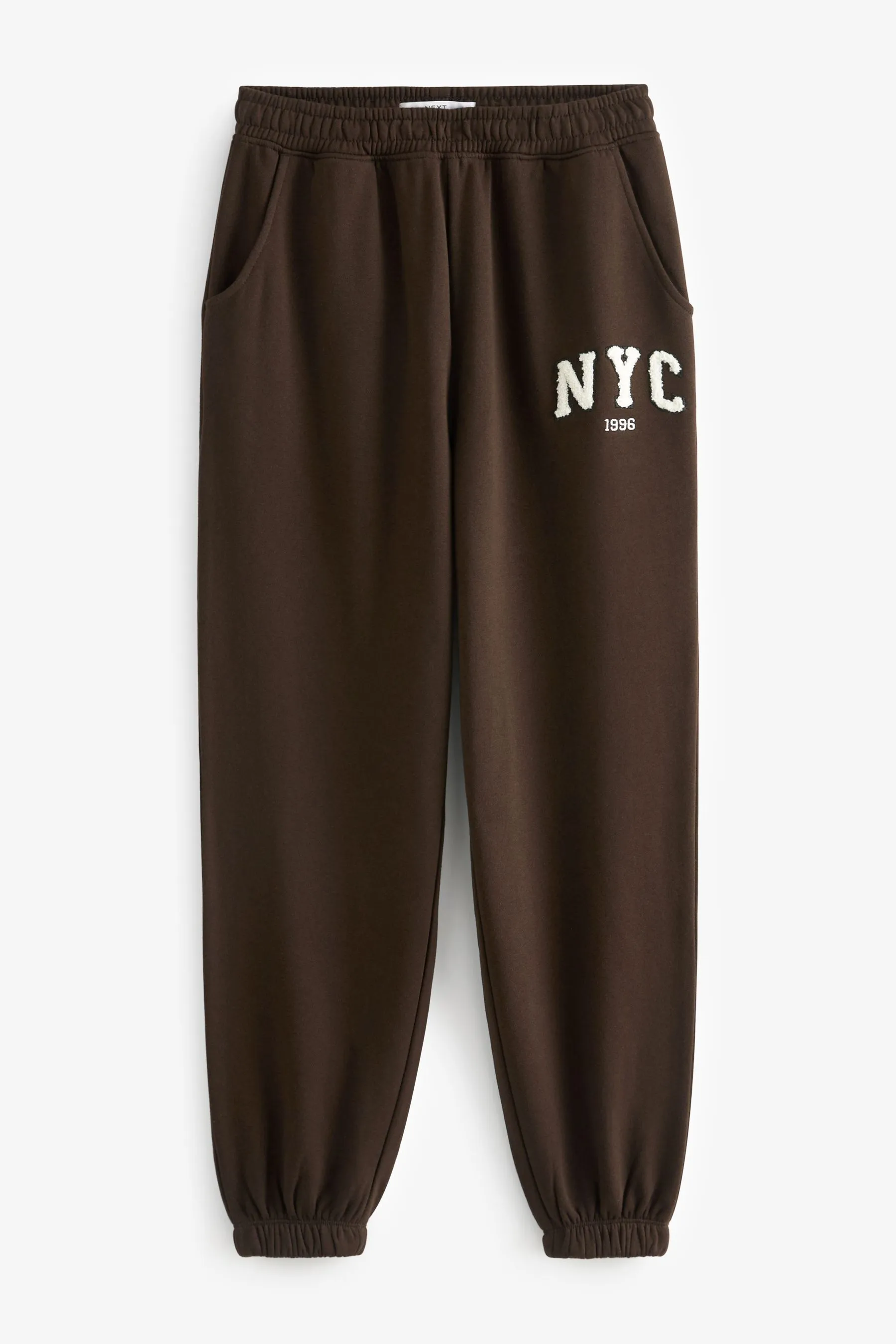 Marrone cioccolato  - Pantaloni da jogging con stampa grafica New York City